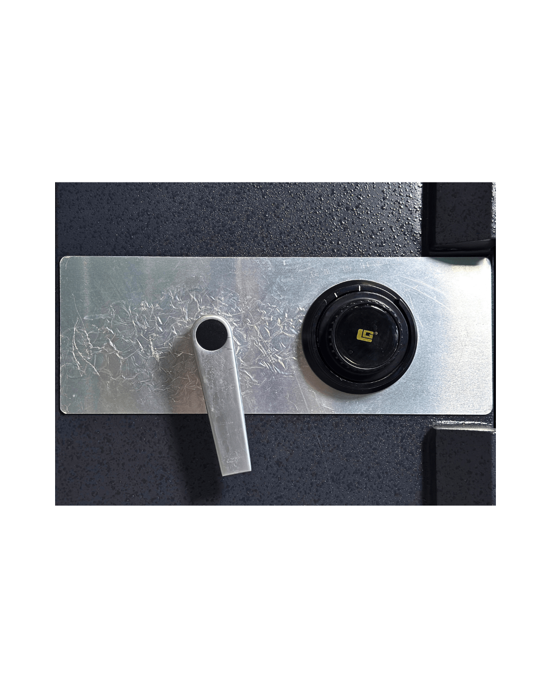 Close-up view of the locking mechanism on the USCAN FB1913-C pre-owned fire burglary safe.